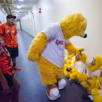 Parker greets kids just before they preform on the field.