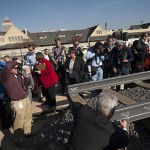 Guests signs a rail at High-Speed Rail groundbreaking ceremony.